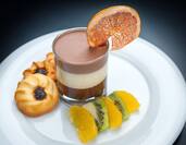 Detailed View of Cookies, Fruit, and Mousse au Chocolat on White Plate