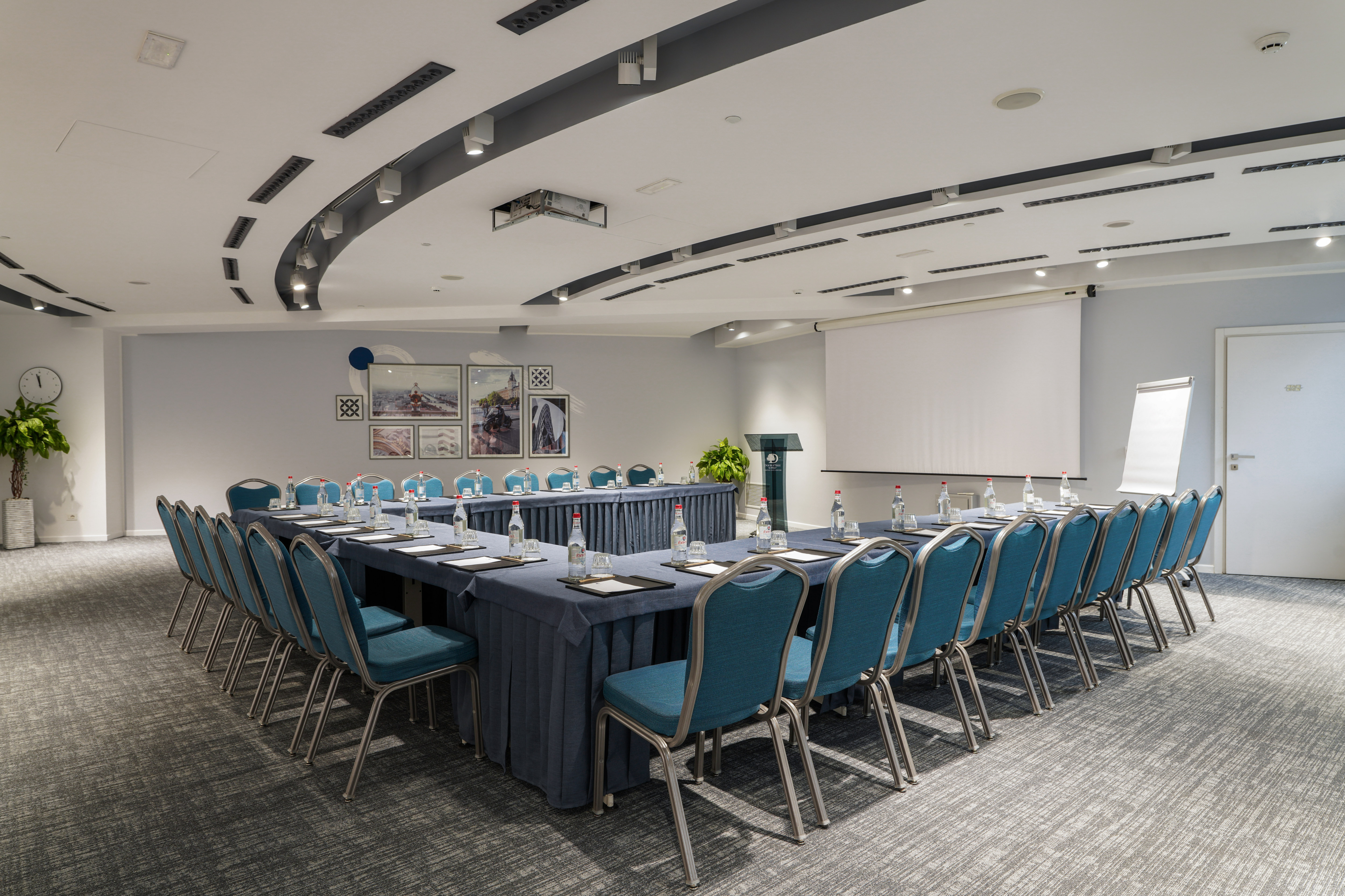 Angle View of Parigi Meeting Room Setup U Style with a Projection Screen