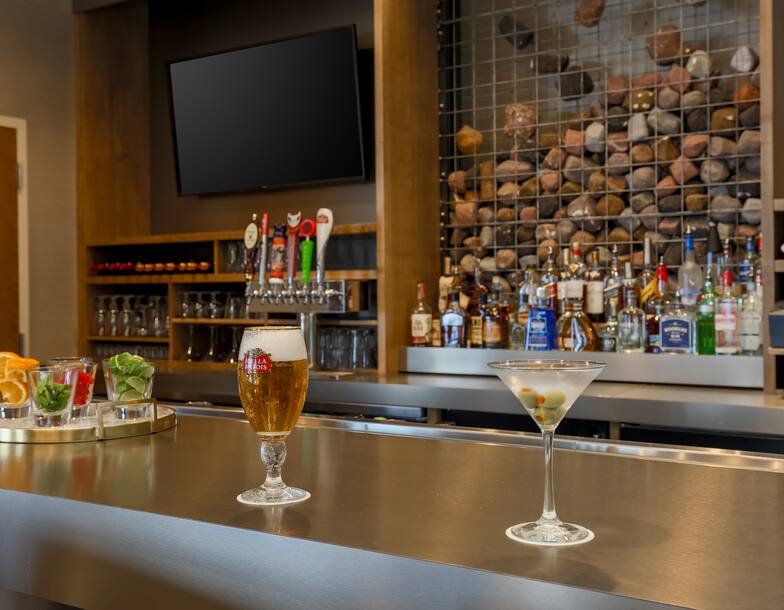 Detailed View of Cocktails on Counter by Fully Stocked Quarry Bar