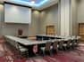 Ballroom Set Up With Seating for 30 at U-Table, Projector Screen, and Podium
