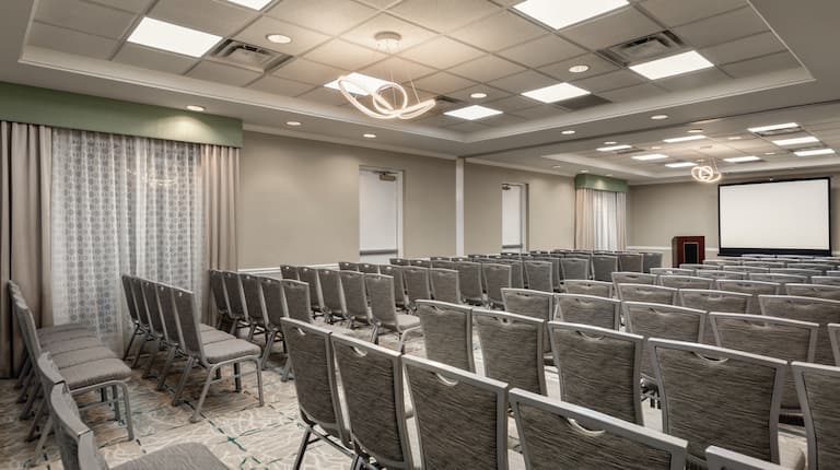 Meeting Room with Conference Setup and Projection Screen