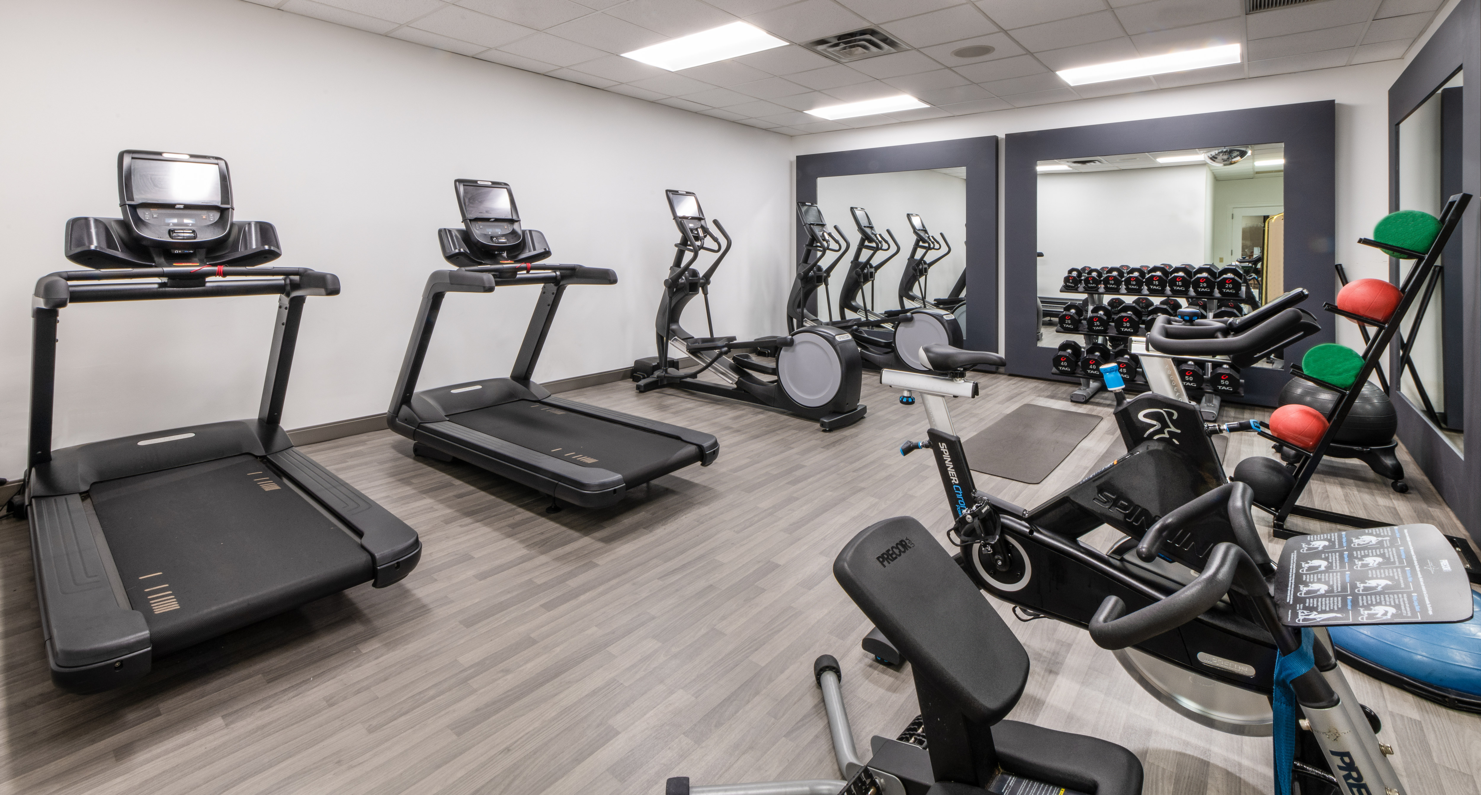 Fitness Center with Recumbent Bikes Treadmills and Weights