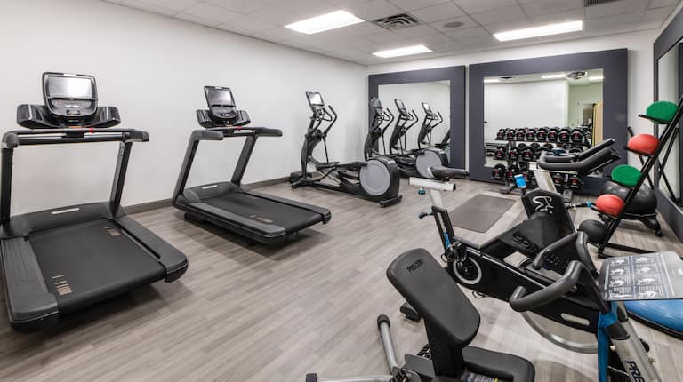 Fitness Center with Recumbent Bikes Treadmills and Weights