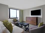 guest room with lounge area window and television