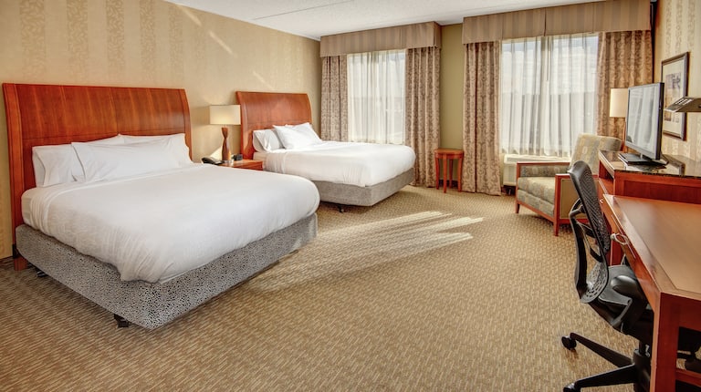 Hearing Accessible Guestroom with Two Queen Beds, Room Technology, Lounge Area, and Work Desk