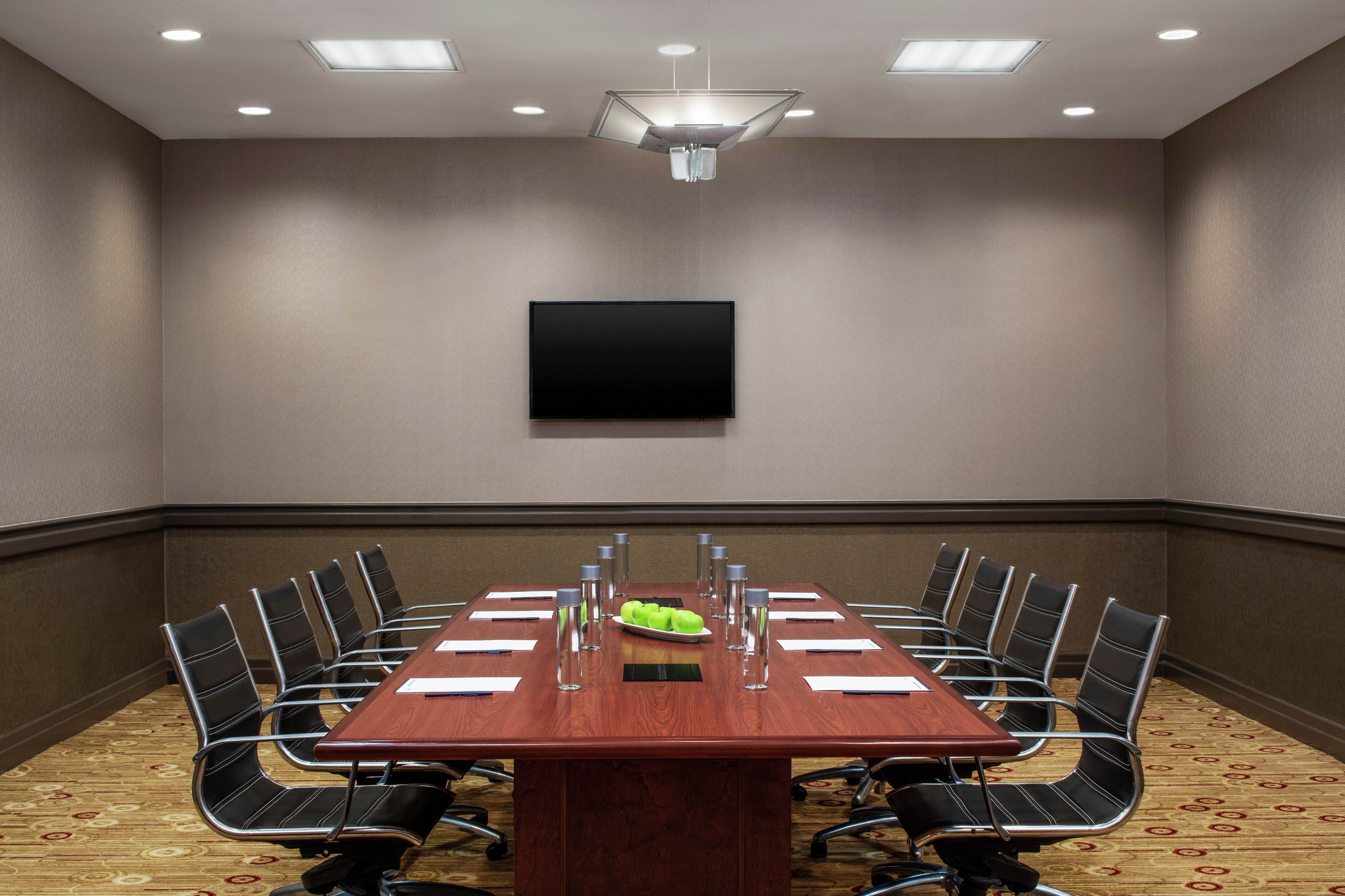 a boardroom table in a meeting room