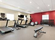 Convenient on-site fitness center fully equipped with cardio machines, spin bicycle, and free weights.