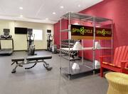 Convenient on-site fitness center featuring cardio machines, free weights, and complimentary towels.
