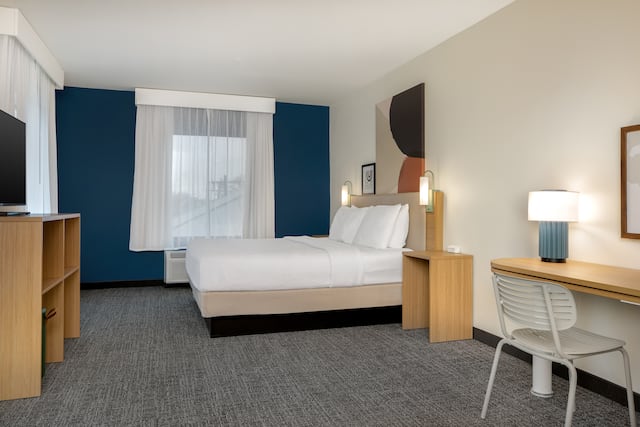 King Guest Room with Bed, Work Desk, Cube Storage, and TV