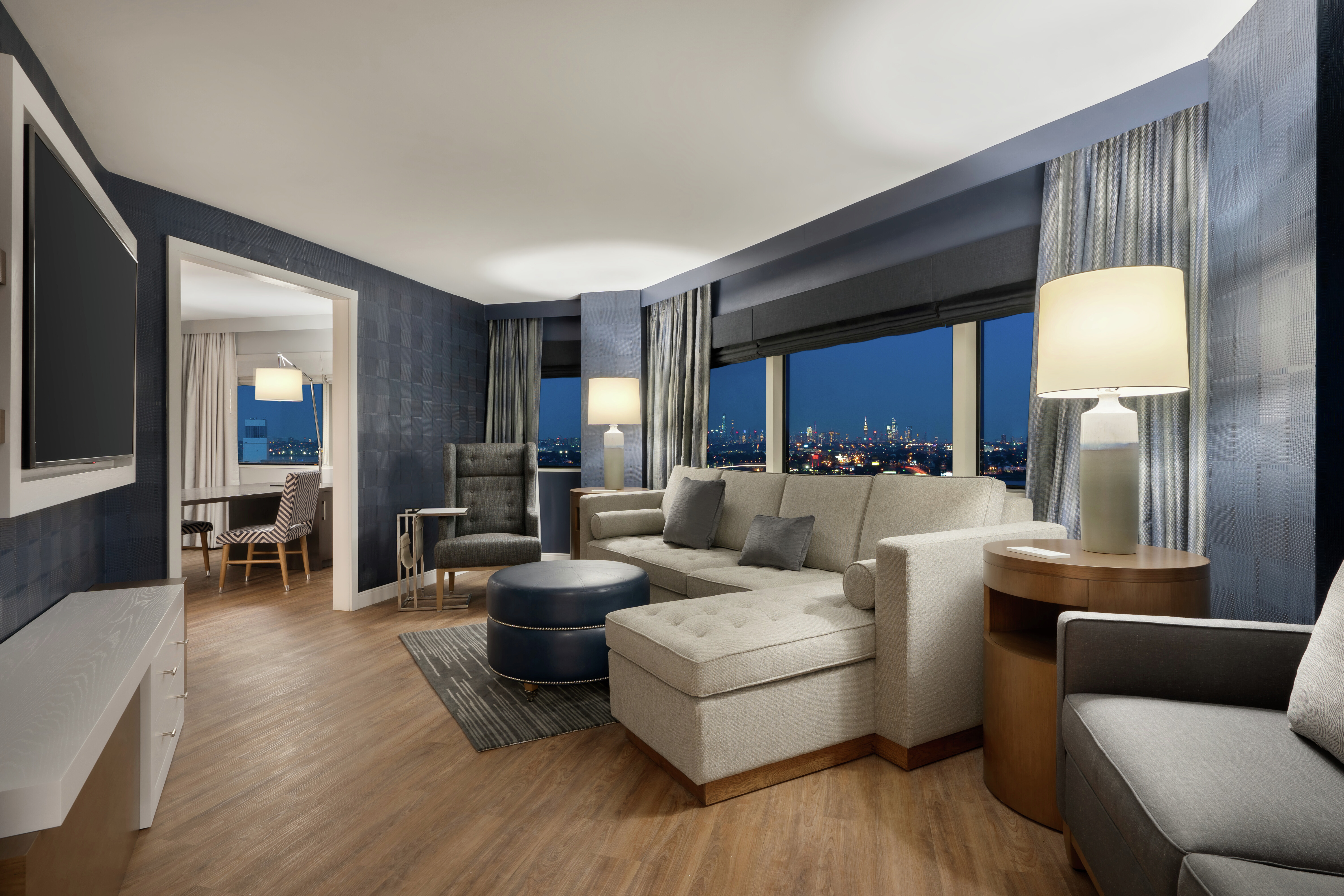 Suite Living Room with Large Windows and City Views