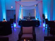 Event in Hotel Ballroom with Colored Lights and Decor