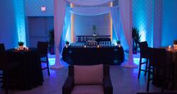 Event in Hotel Ballroom with Colored Lights and Decor