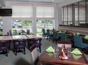 Garden Grille Restaurant with TV and Ample Seating