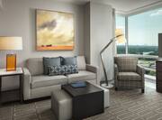 Suite Living Area with Sofa and Large Windows