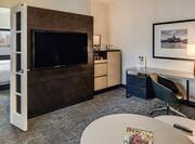 Guest Suite Living Room with Wall Mounted HDTV and Work Desk