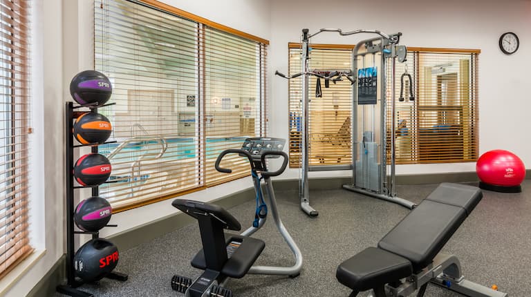 Fitness Center Area with View of Indoor Pool
