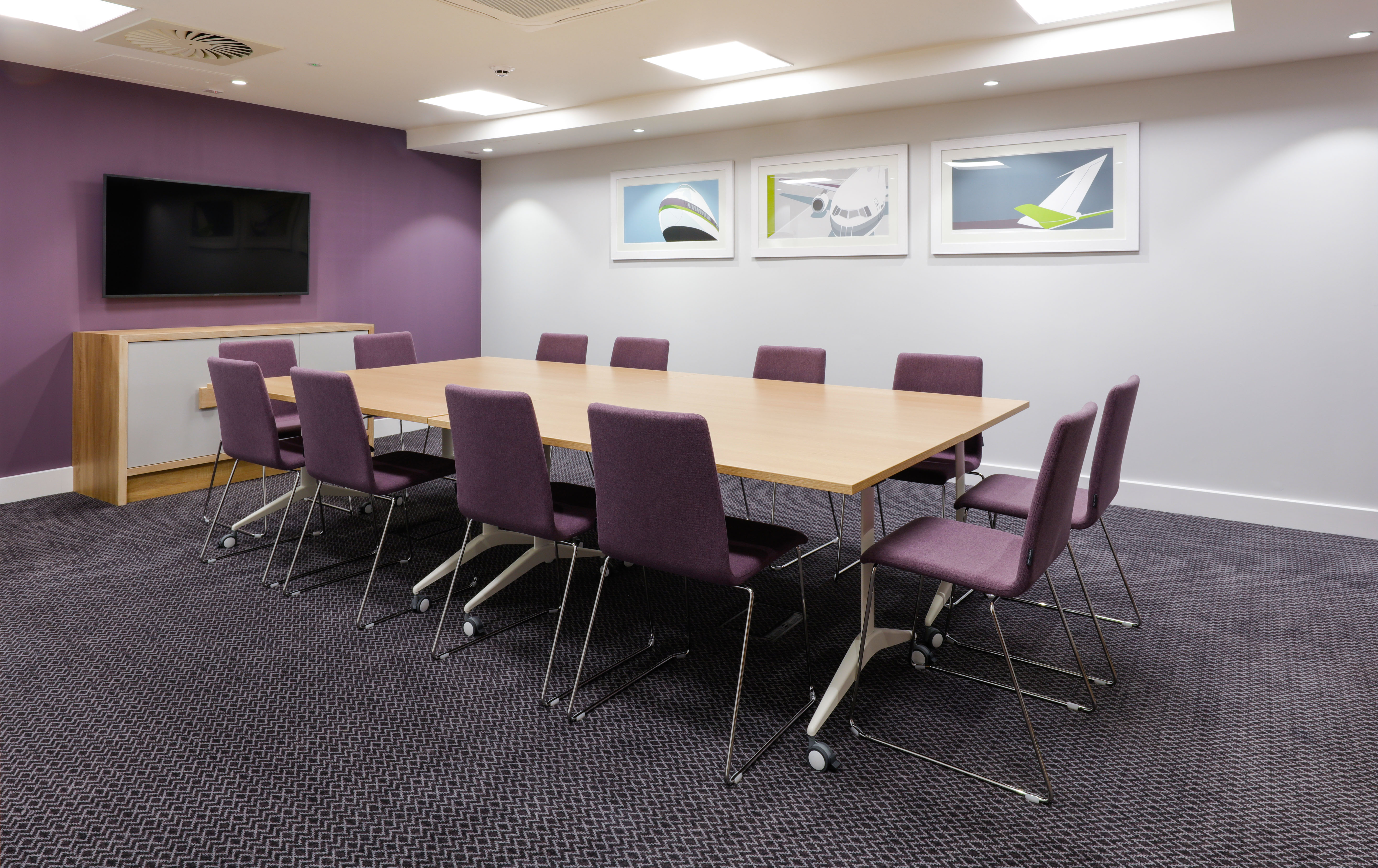 Meeting Room with Conference Table and Wall Mounted Television