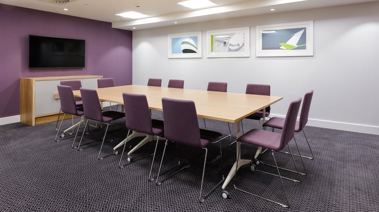 Meeting Room with Conference Table and Wall Mounted Television