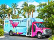 colorful shuttle bus and palm trees
