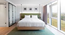 Large Bed in Bright Hotel Guest Room