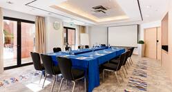Meeting Room With U-Shaped Table and Projector