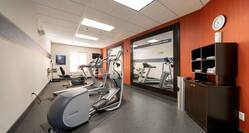 fitness center with exercise bikes and treadmills