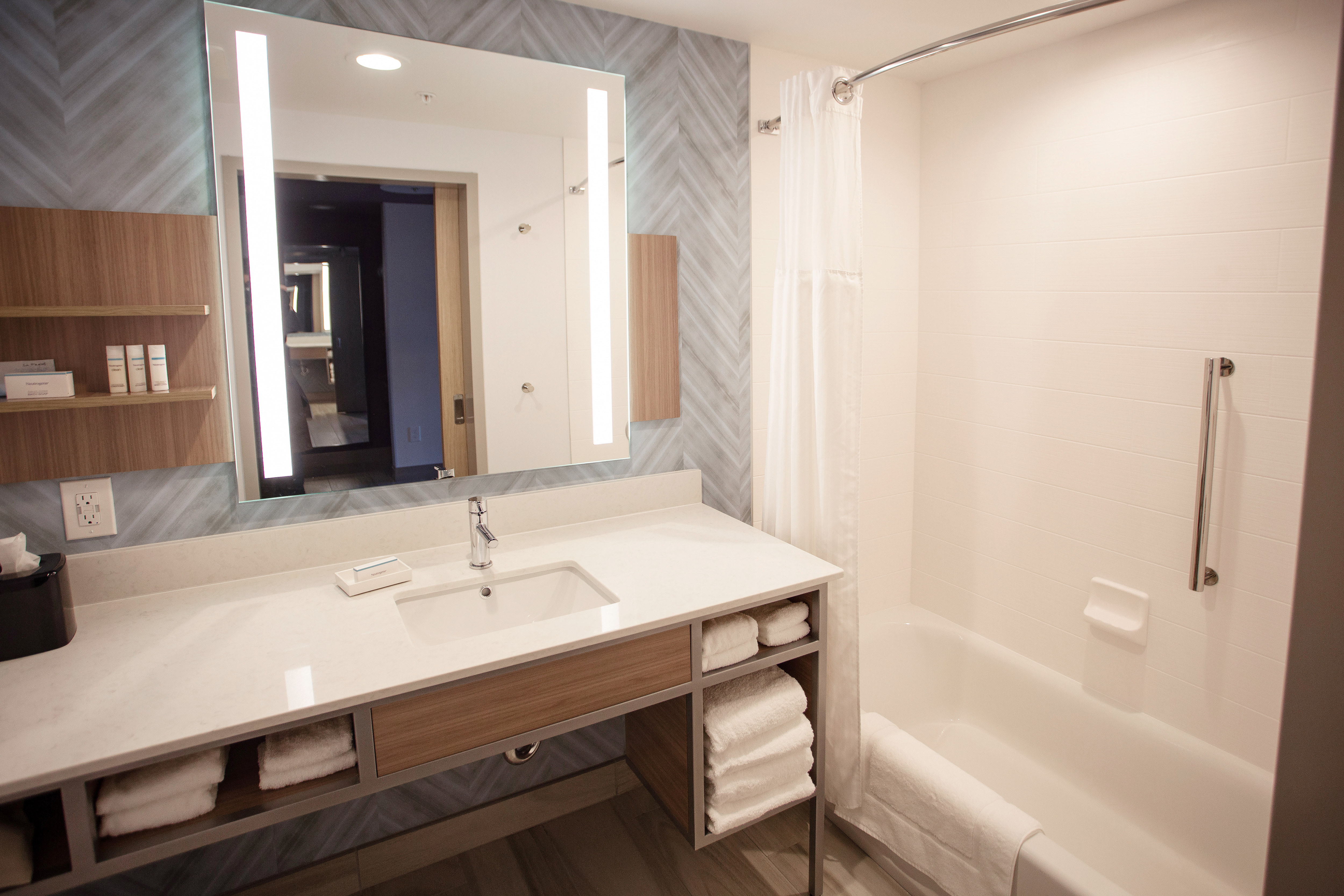 Bathroom Vanity Area and Bathtub in Guest Room