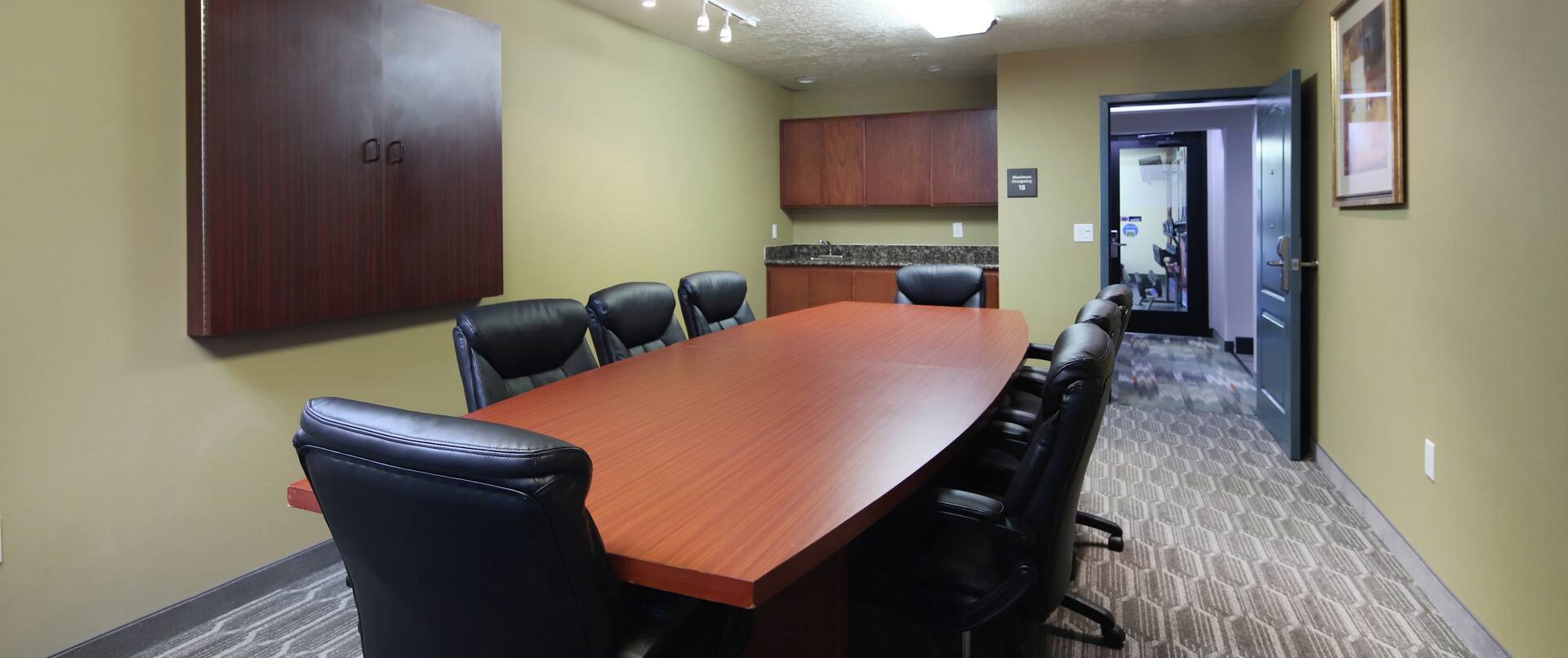 Boardroom with Large Meeting Table and Office Chairs