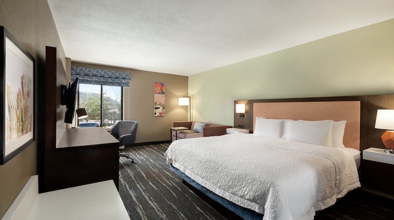 bed in room with workdesk