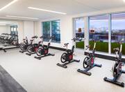 Fitness Center with Exercise Bikes and Large Windows