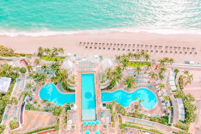 Aerial View of Beachfront Resort with Large Swimming Pools
