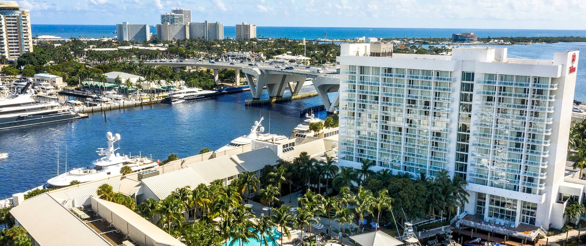 Aerial View of Hilton Hotel Exterior by the Water