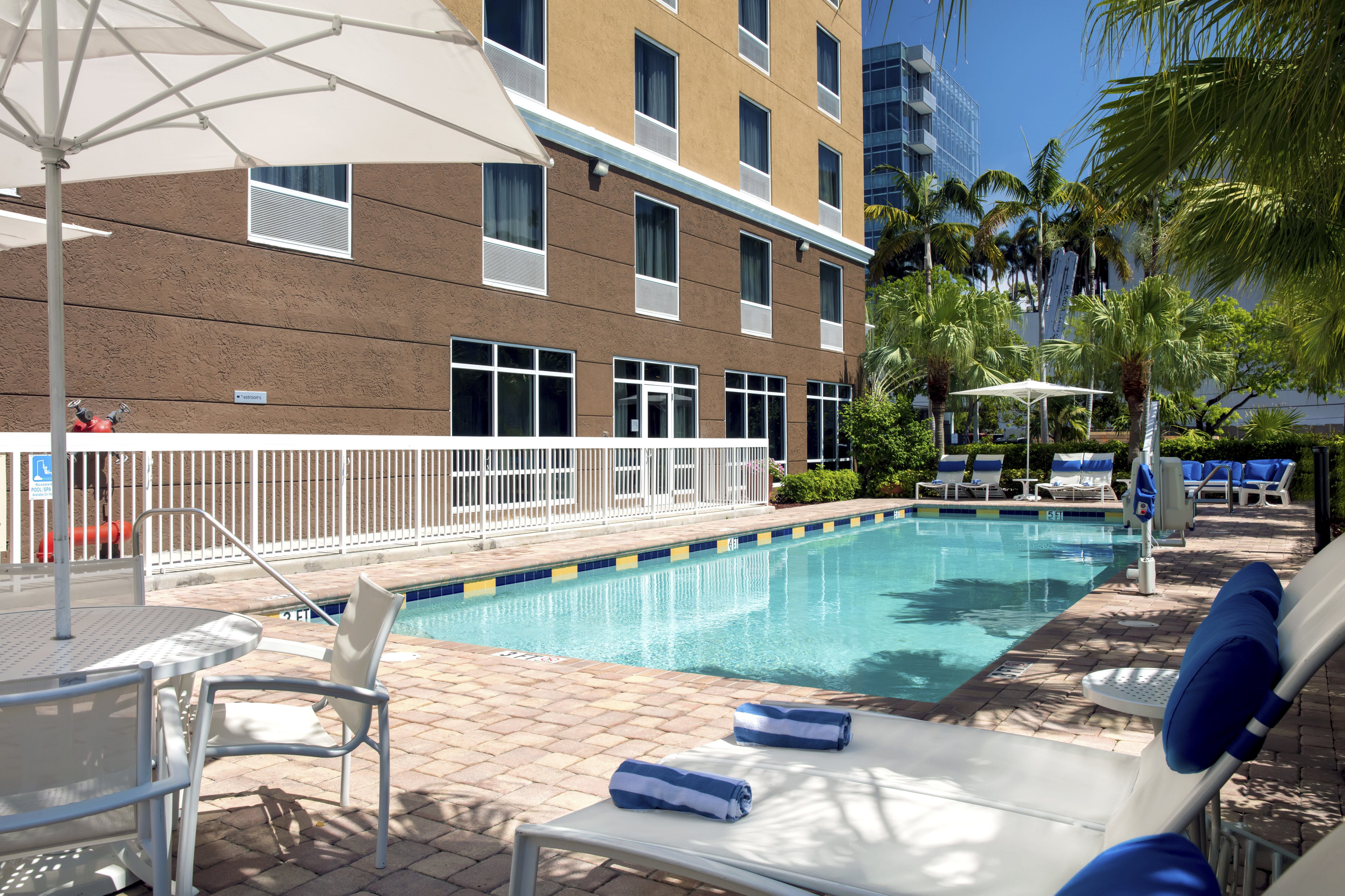 Outdoor Pool Area and Hotel Exterior