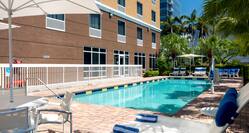 Outdoor Pool Area and Hotel Exterior