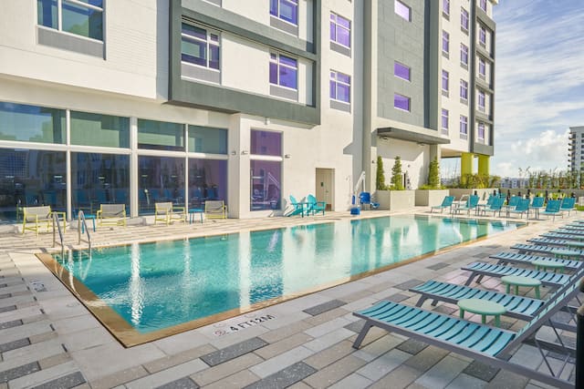 outdoor pool, lounge chairs