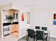 Suite Kitchen Area with Stainless Appliances Table and Four Chairs