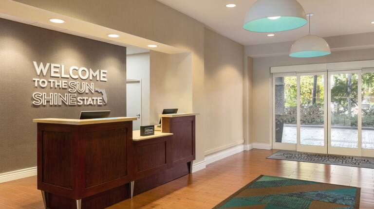 A welcoming front desk and lobby with modern interior design 