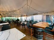 Victors Bar Patio Seating Area With Overhead Tent Covering