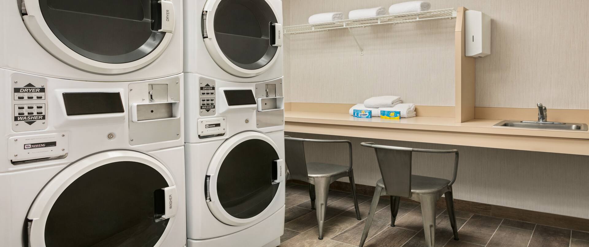 Laundry area with machines and waiting area