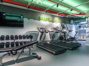 Fitness Center with Treadmills, Cross-Trainer, Weight Bench, Dumbell Rack and Wall Mounted TV