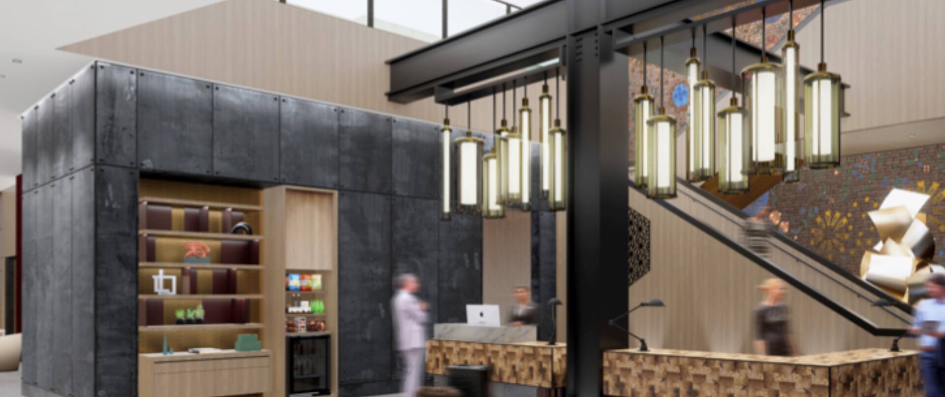 Lobby area with front desk reception and blurred guests