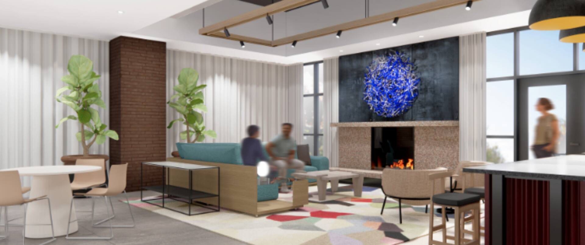 Lobby seating with fireplace and blurred guests