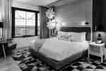 Holiday guesr room with one king bed and winter decorations.