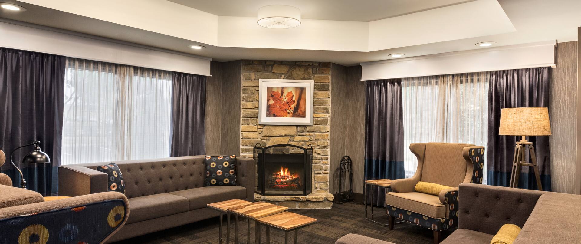 Lobby Seating Area with Sofas, Armchairs and Fireplace