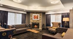 Lobby Seating Area with Sofas, Armchairs and Fireplace