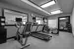 Spacious on-site fitness center fully equipped with cardio machines, free weights, and medicine balls.