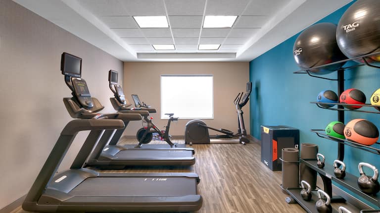 on site fitness center, treadmills, Peloton bike, yoga balls