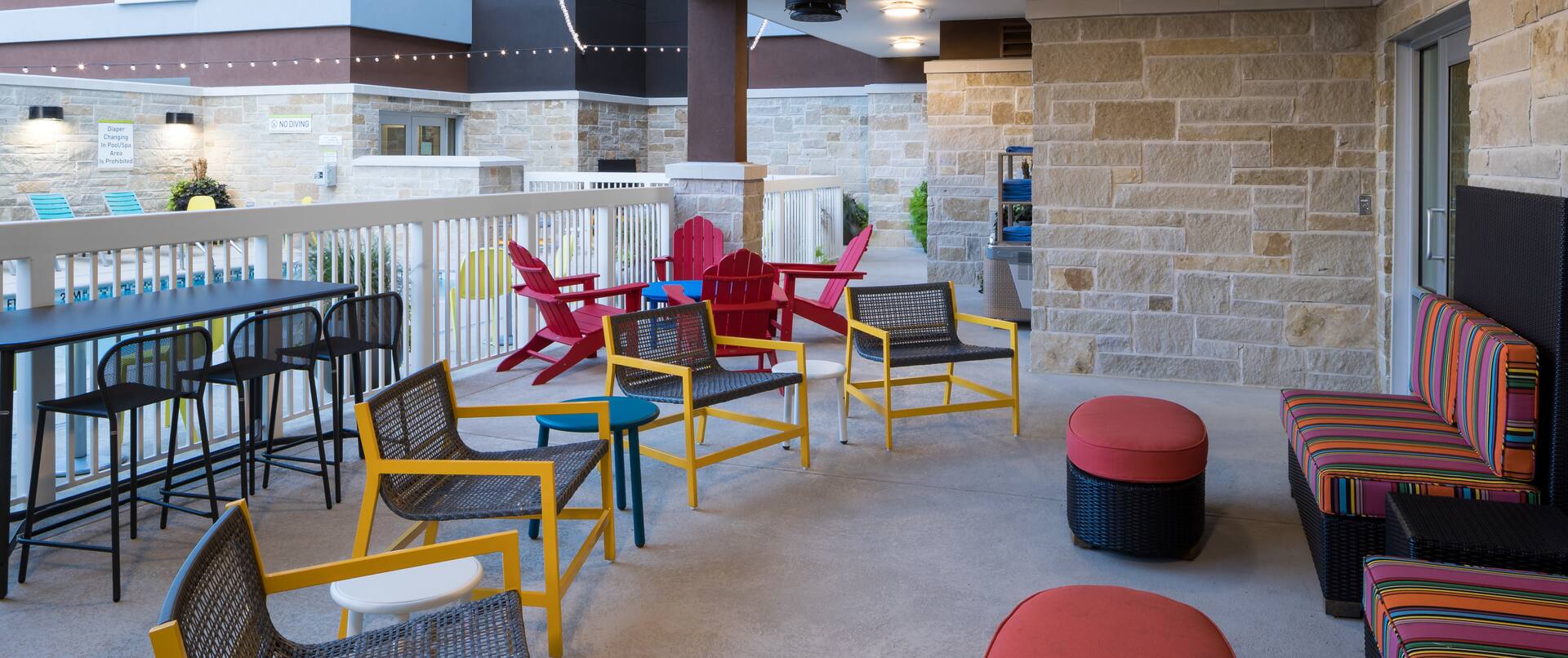 Outdoor seating area with tables and chairs