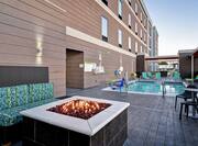Outdoor Patio with Firepit, Seating, and Pool