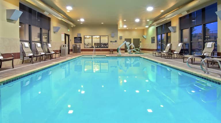 Indoor swimming pool with seating area
